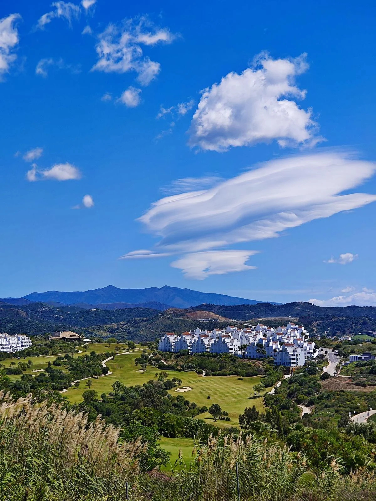 Golf course with a view of the mountains